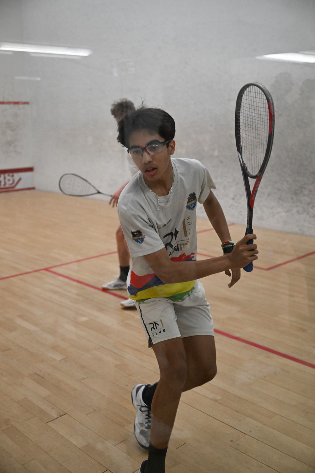 Mathias en match sur le court